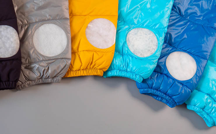 Colorful jackets displaying comfortemp® insulation application through circular cutouts in each sleeve.