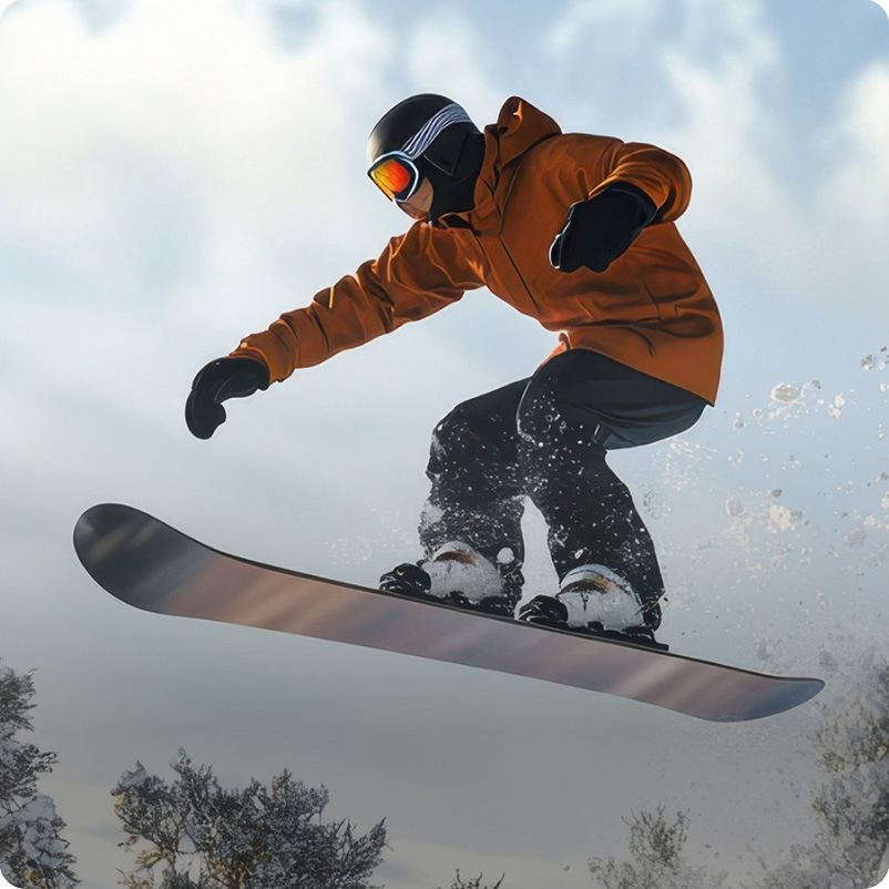 A snowboarder in a brown jacket with comfortemp® insulation, protected from the cold in a snowy mountain landscape.